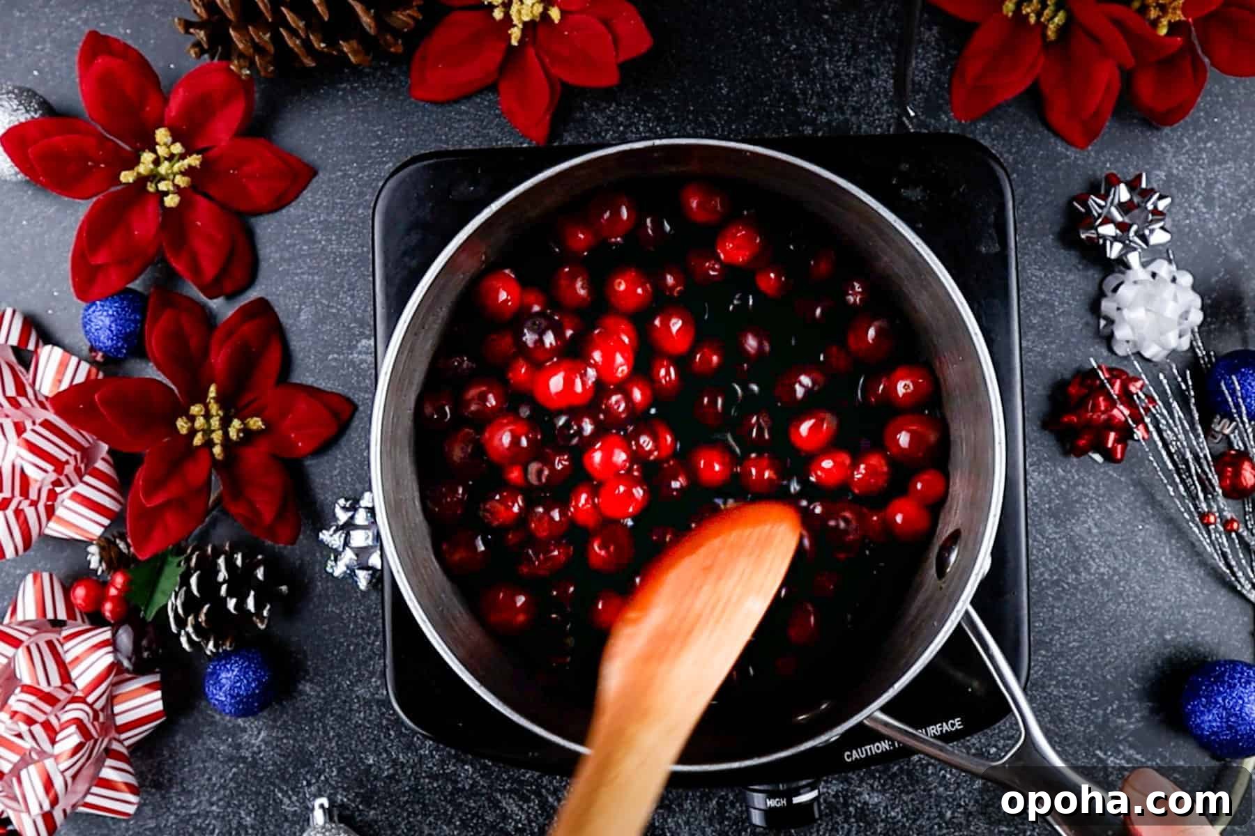 Festive Christmas Fruit Salad with Citrus Pomegranate Dressing 6 coating cranberries in sugar syrup is saucepan.