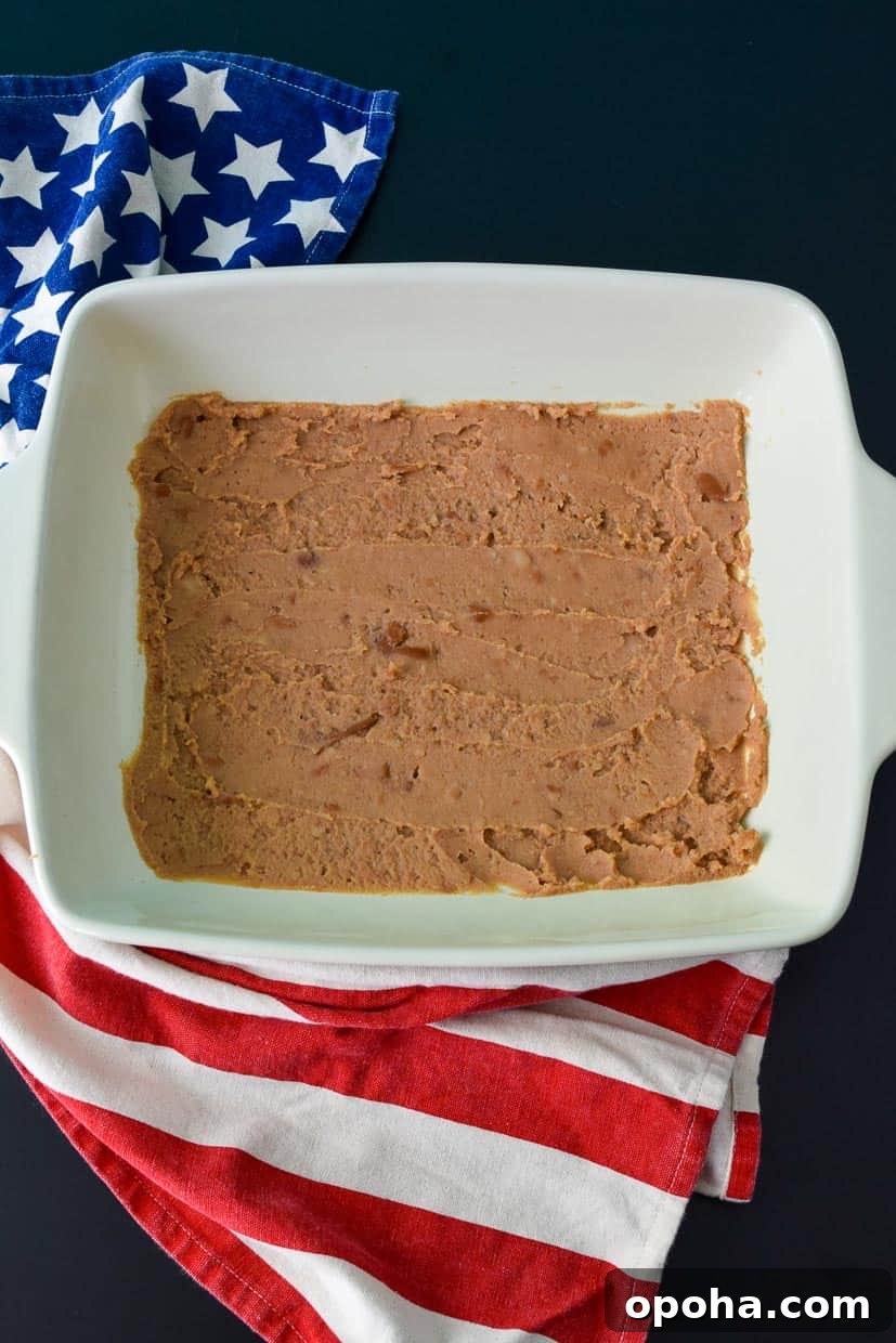 9x13 pan with refried beans overhead shot