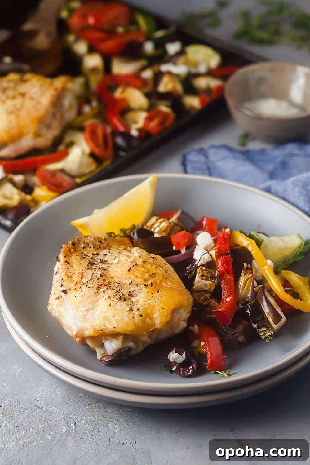 30+ Sheet Pan Dinners for Busy Weeknights: Quick Family Meals 5 Sheet Pan Mediterranean Chicken Thighs on a plate.