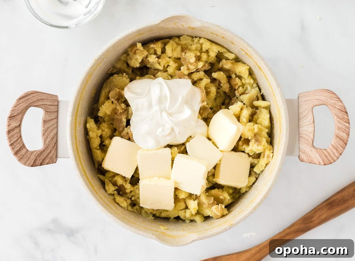 Creamy Mashed Potatoes with Sour Cream and Chives 9 butter and sour cream added to the potatoes