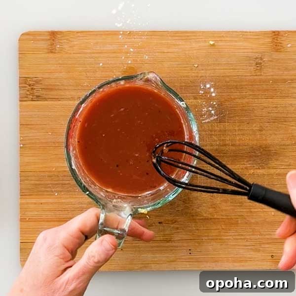 Gluten-Free Sweet and Sour Chicken Made in a HexClad Pan 5 Stirring sweet and sour sauce.
