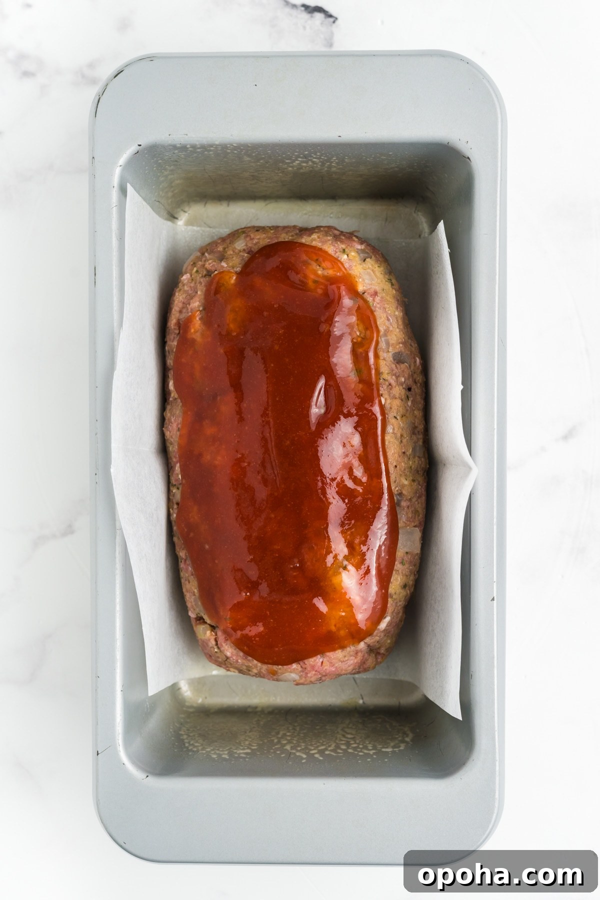 The glaze mixture on the meatloaf.