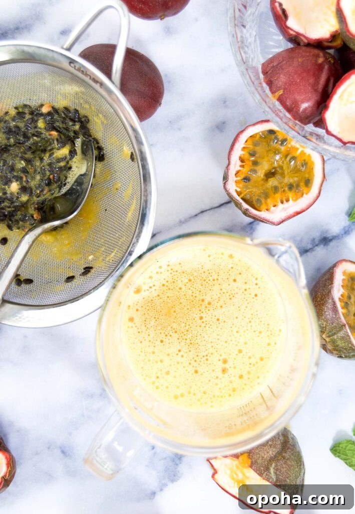 Fresh Passion Fruit Juice Recipe: Tangy Homemade Drink 6 Passion fruit puree in a liquid measuring cup on marble