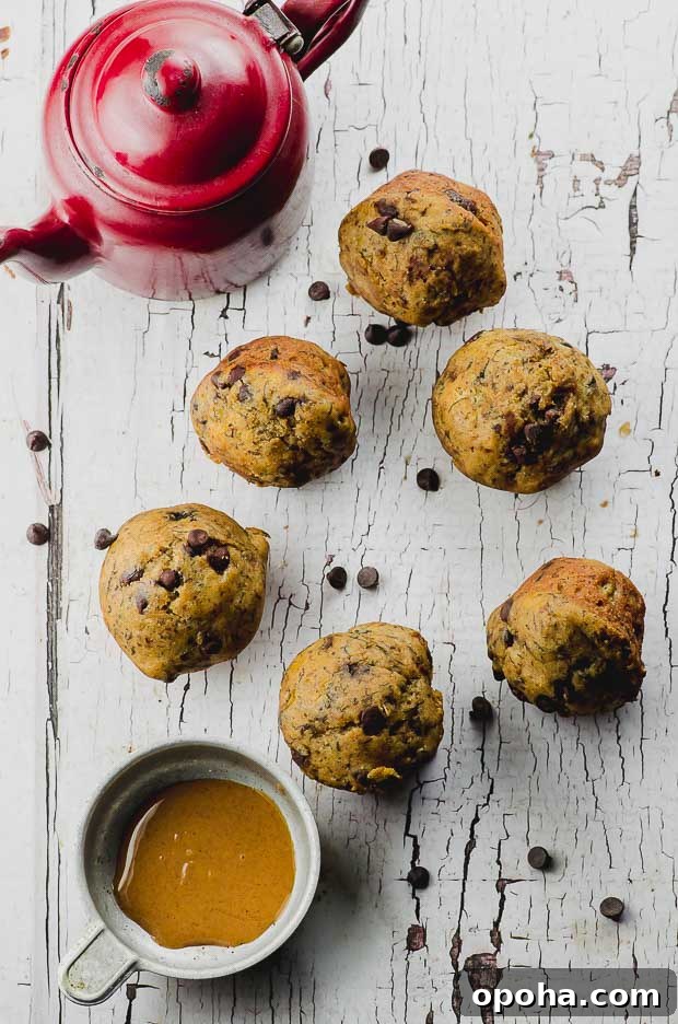 Moist Banana Chocolate Chip Muffins: Simple Homemade Recipe 3 Bird's eye view of 6 vegan peanut butter chocolate chip banana mini muffins piled