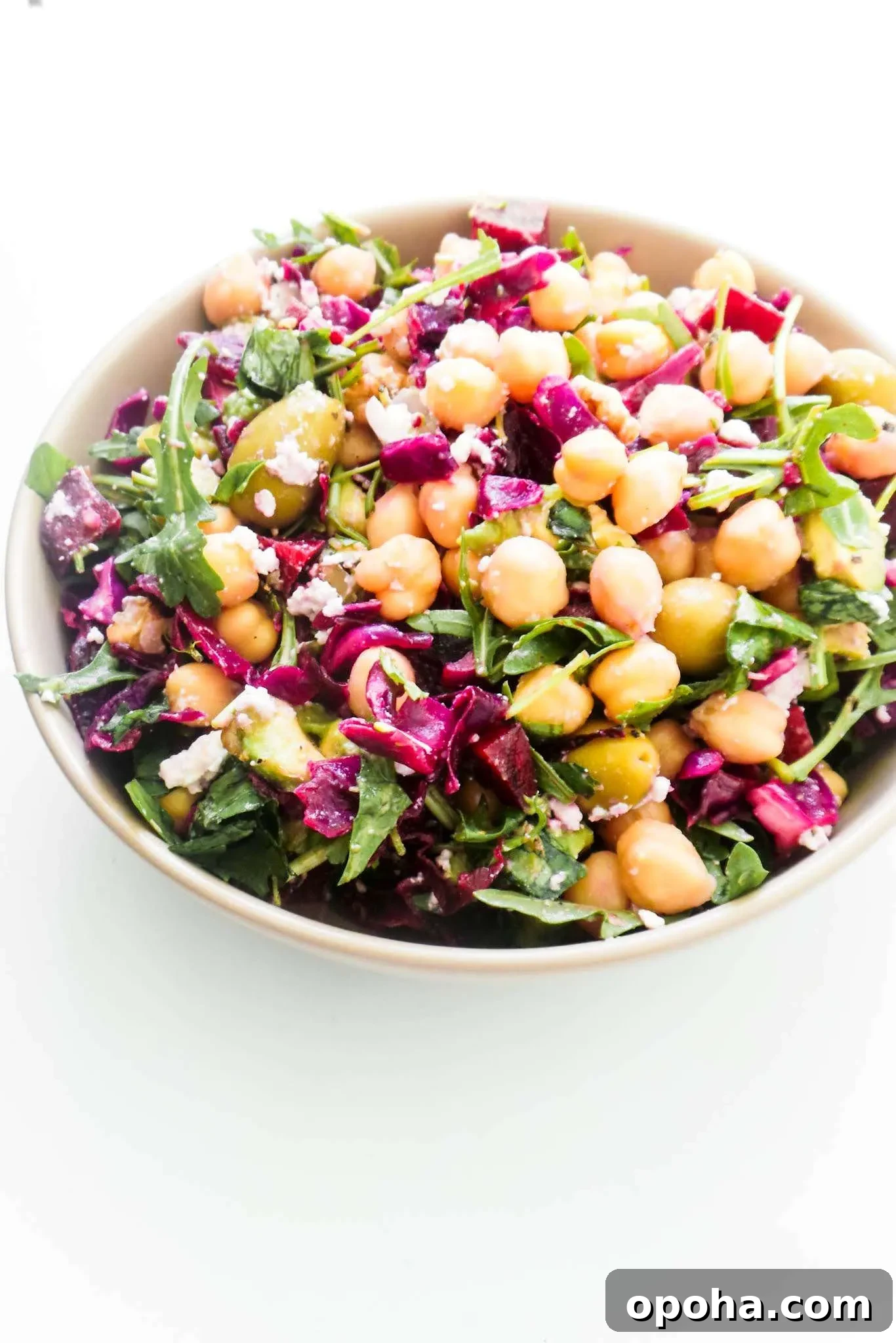Easy Mediterranean Chickpea Salad recipe! This healthy Mediterranean diet recipe is perfect for lunch or dinner and makes a great clean eating side dish too! With cabbage, chickpeas, olives and beets this healthy salad is filled with antioxidants, protein and fibre and is also a great winter salad recipe! This easy salad recipe is vegetarian and gluten-free, but it’s also easily made vegan by leaving out the feta cheese! You need around 15 minutes to make it.