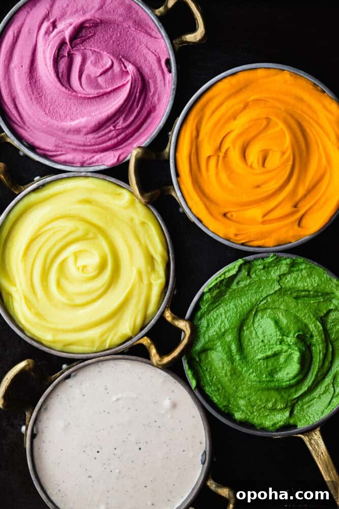 colorful Middle Eastern dips, including pink beet, orange carrot, yellow carrot, green tahini and whipped feta.