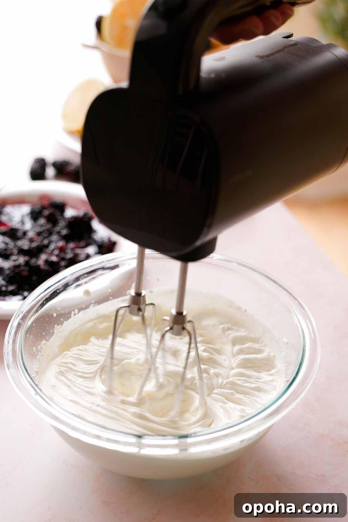 whipping cream in a large bowl to stiff peaks