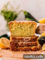 slices of lemon zucchini bread stacked on top of eachother