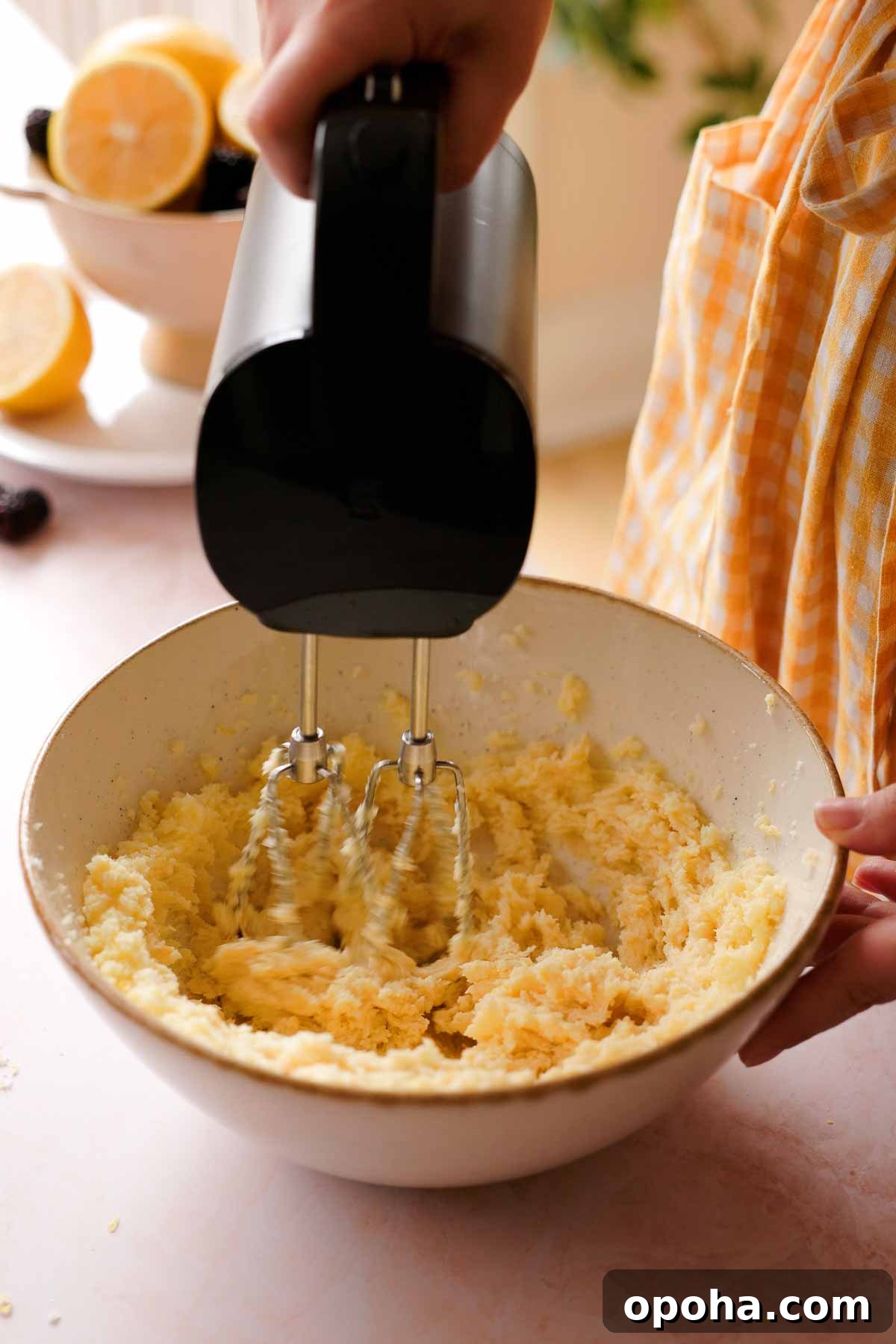 creaming butter and lemon sugar with an electric mixer