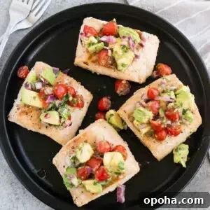 mahi mahi filets with avocado tomato topping served on a plate