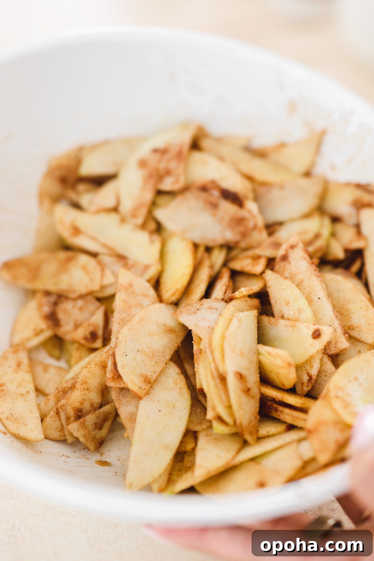 Vegan Miso Caramel Apple Pie Recipe for Cozy Fall Desserts 5 raw sliced apples in a white dish