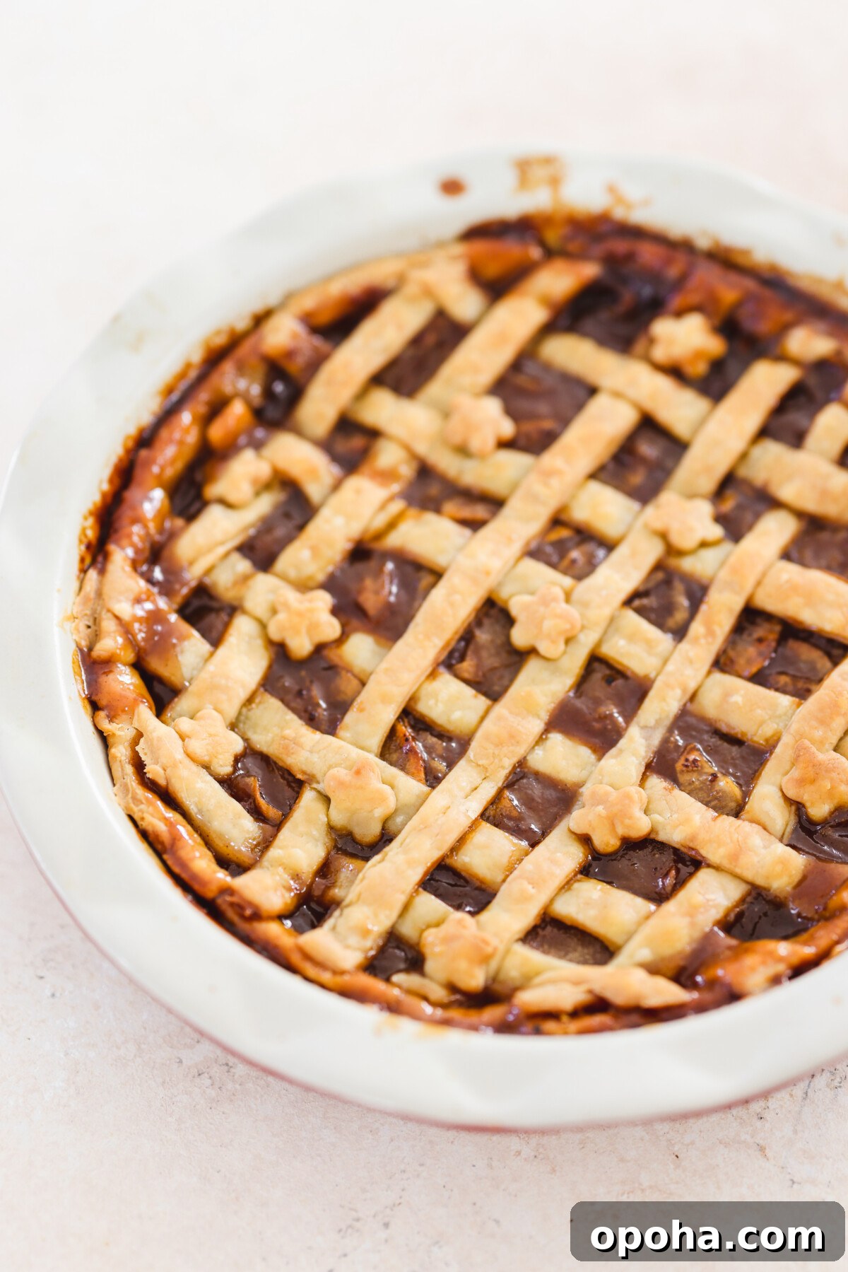 Vegan Miso Caramel Apple Pie Recipe for Cozy Fall Desserts 7 a baked miso caramel apple pie in a white pie dish
