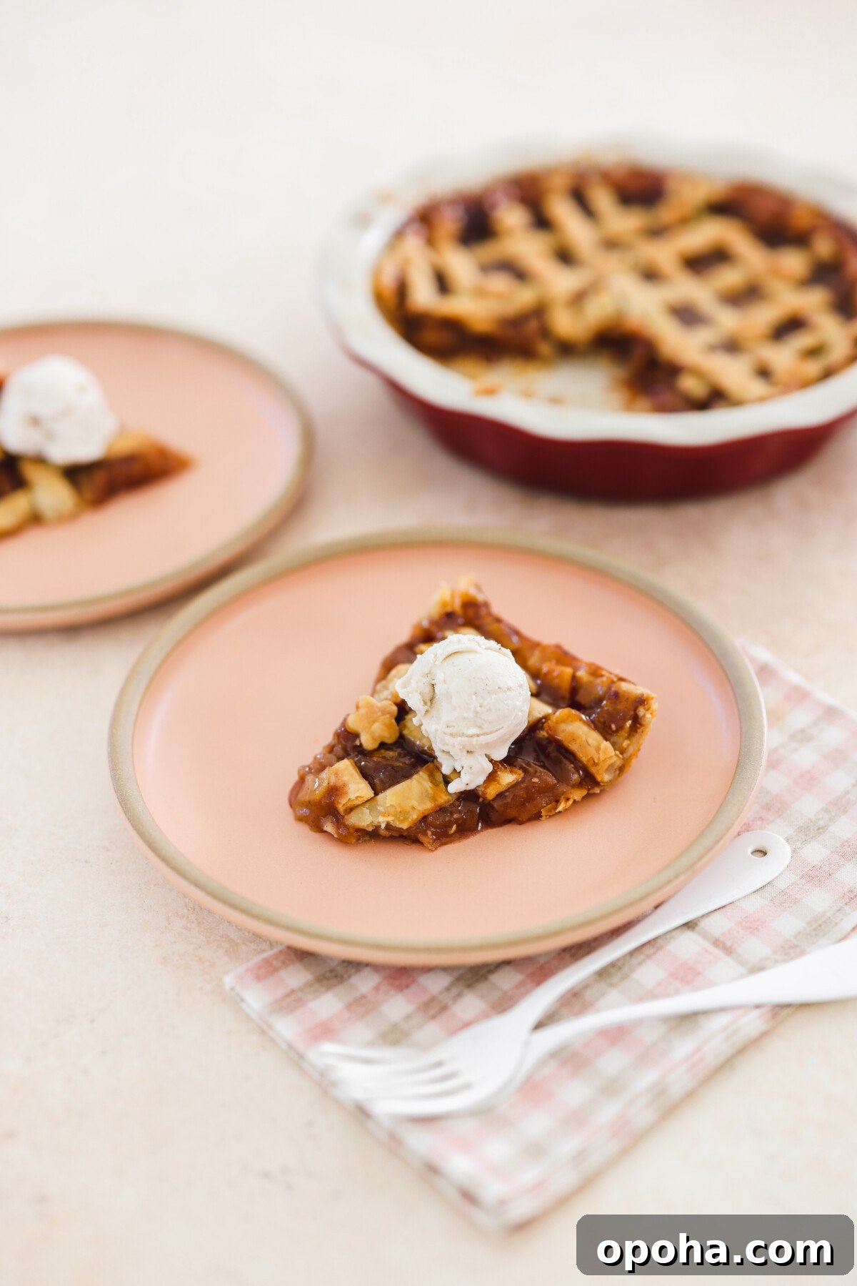 Vegan Miso Caramel Apple Pie Recipe for Cozy Fall Desserts 8 a slice of pie on a pink plate
