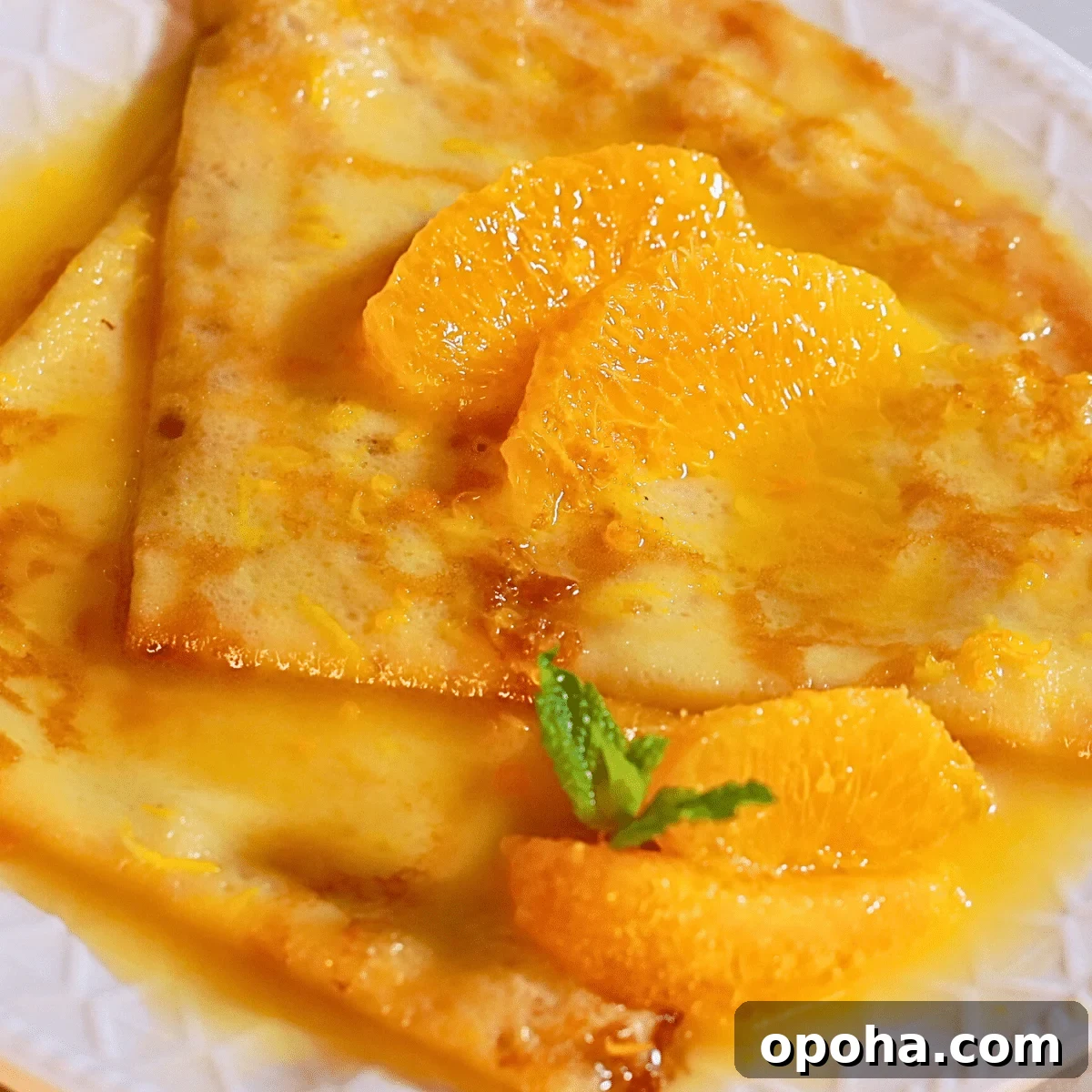 delicious crepes suzette with easy orange butter sauce on a plate