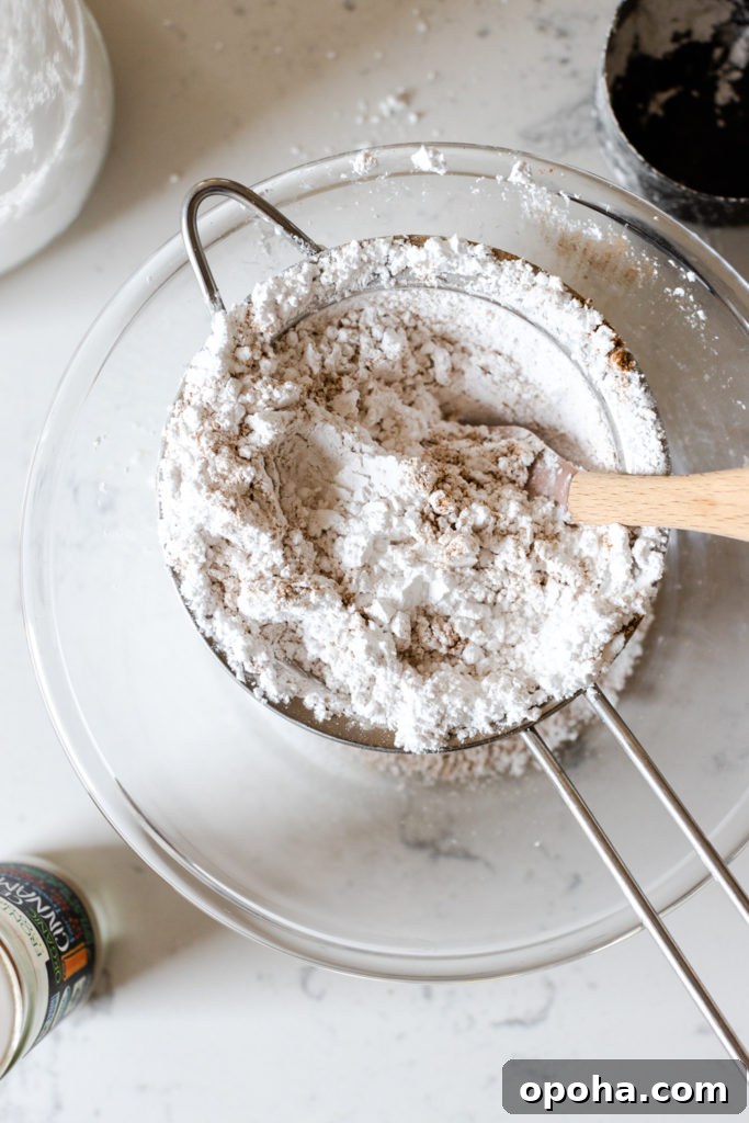 Pumpkin Spice Quick Bread with Maple Cream Cheese Frosting 9 sifting powdered sugar and cinnamon