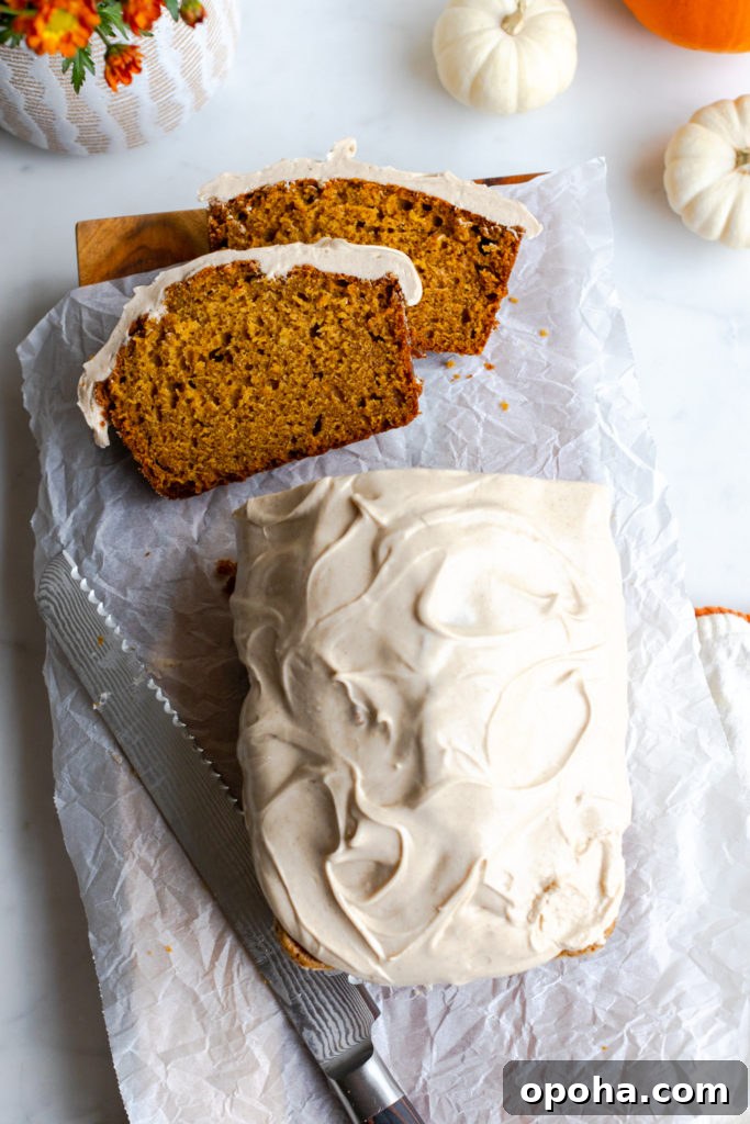 Pumpkin Spice Quick Bread with Maple Cream Cheese Frosting 16 Slicing Pumpkin Spice Bread with Maple Cream Cheese Frosting