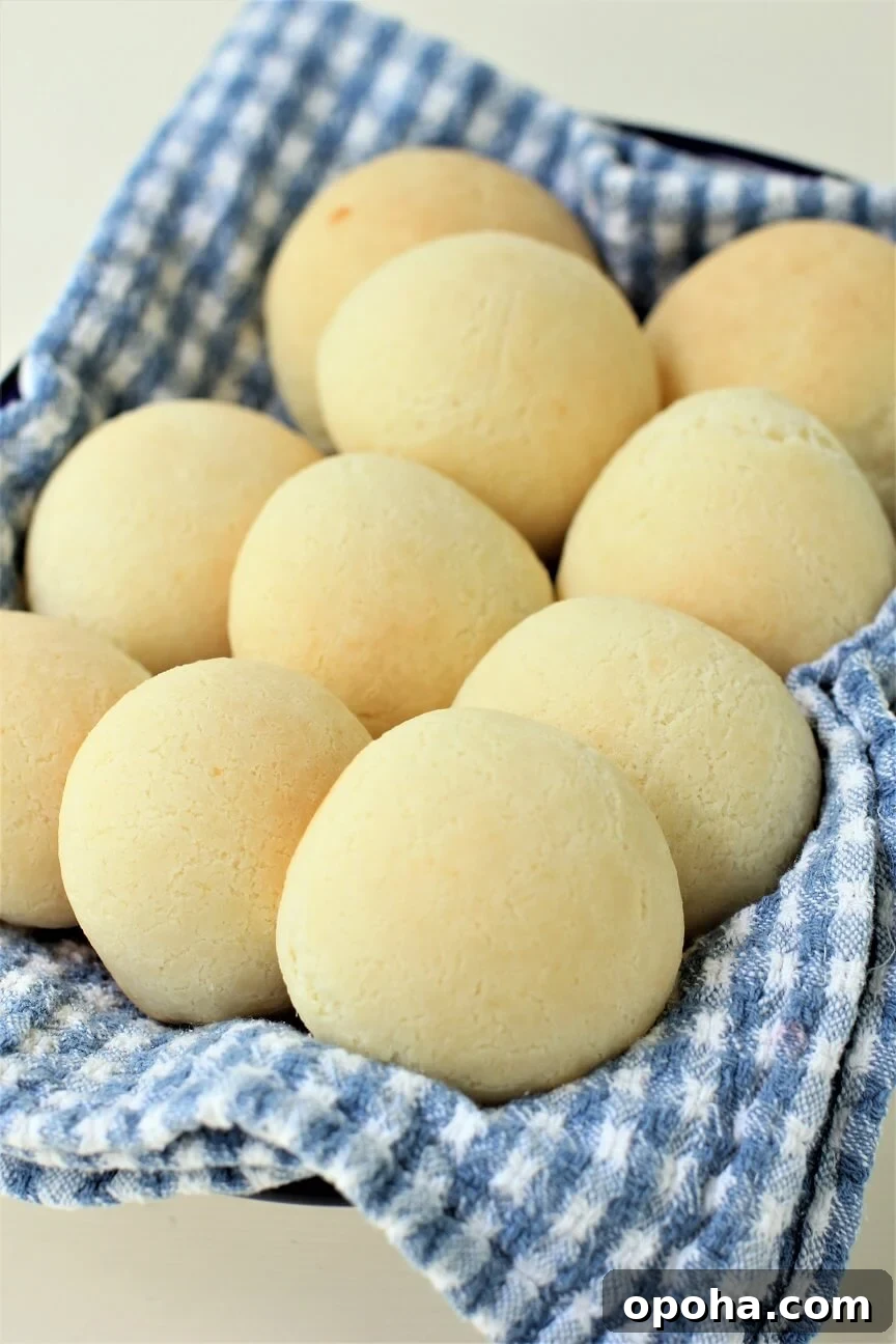 Pan de Yuca: Warm Cheesy Colombian Buns You’ll Love 2 fresh pan de yuca cheese buns on a tea towel
