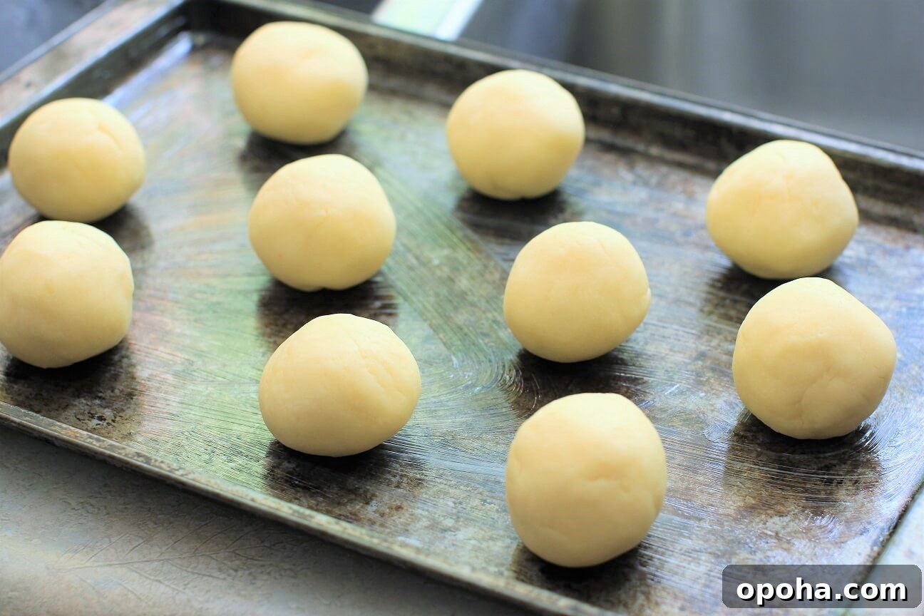 Pan de Yuca: Warm Cheesy Colombian Buns You’ll Love 5 the dough is rolled into balls and ready for the oven