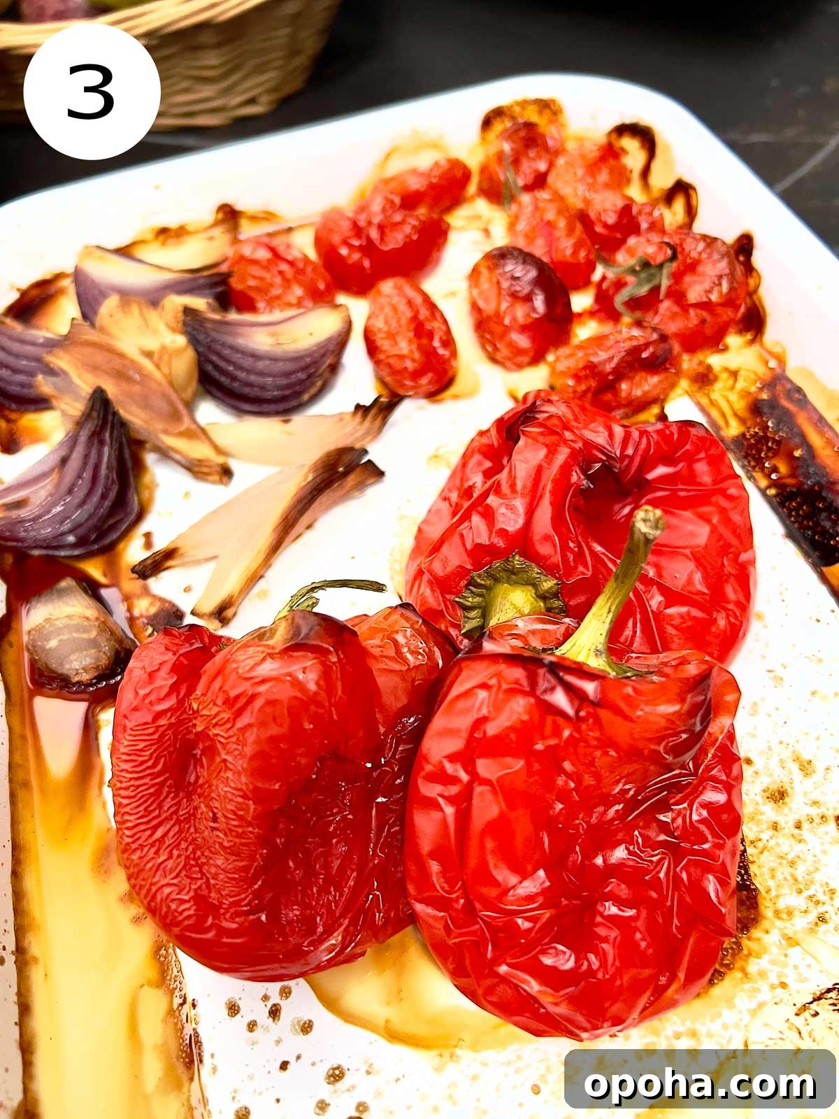 Roasted red bell pepper sauce ingredients out of the oven ready to go in blender.