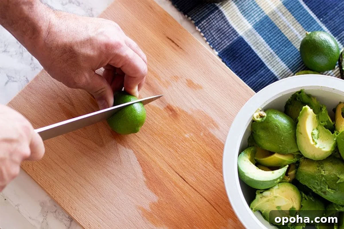 Pan-Seared Salmon with Refreshing Cucumber Salad 5 Person slicing limes.