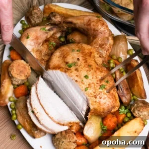 Tender Whole Chicken in a Slow Cooker: Juicy, Simple Recipe 3 slicing slow cooker chicken which is served on a platter plate with peas, parsnips, carrots, onion and stuffing balls