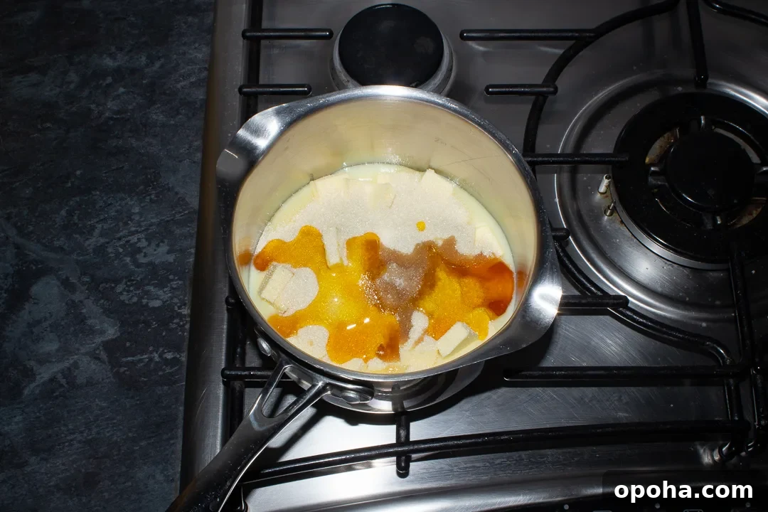 Halloween Millionaire Brownies: Rich Chocolate Caramel Treats 17 Condensed milk, butter, sugar, golden syrup, vanilla and salt in a saucepan set over a low heat on a stove top.