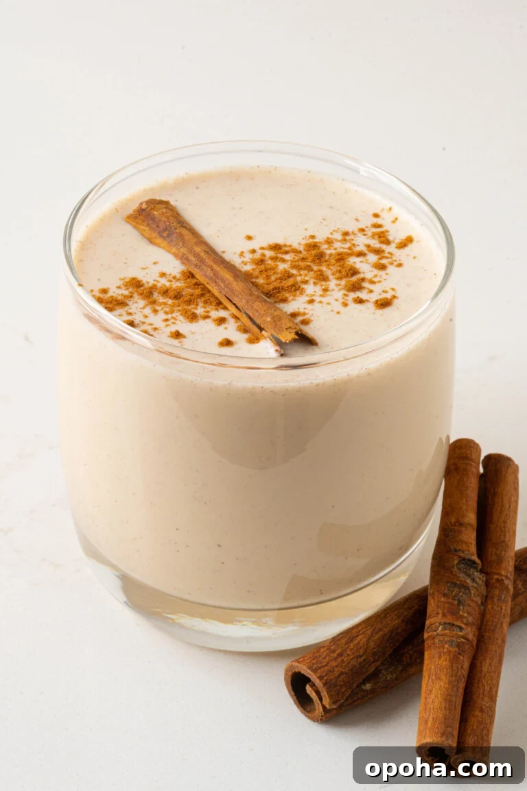 a glass of coquito on a counter