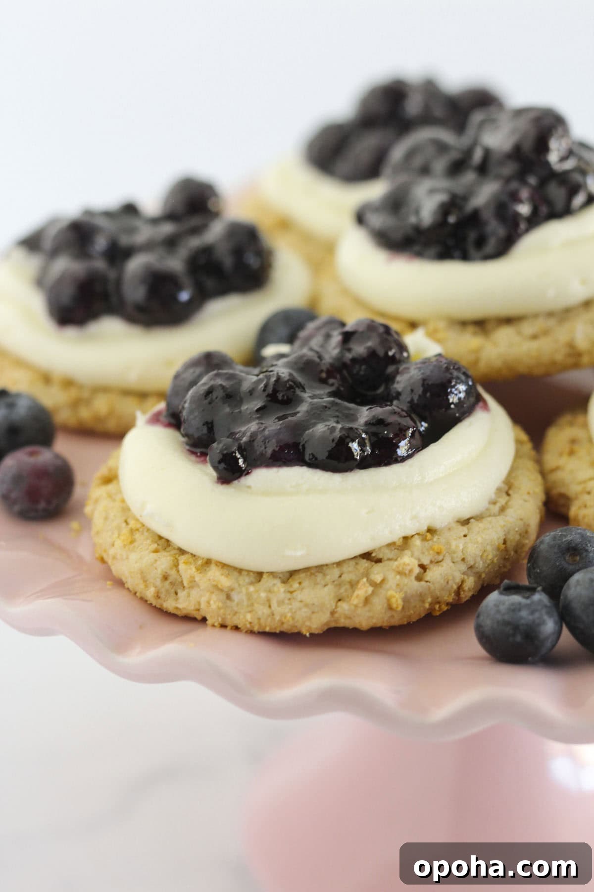 Blueberry Cheesecake Cookies on a pink cake plate.