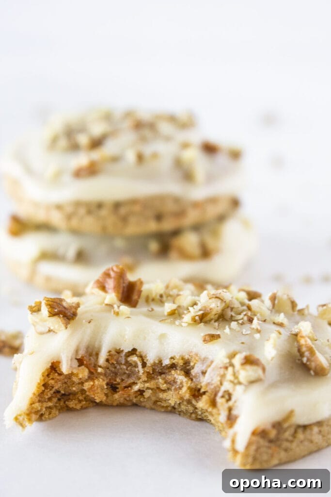 Carrot cake mix cookies with cream cheese glaze and chopped pecans.