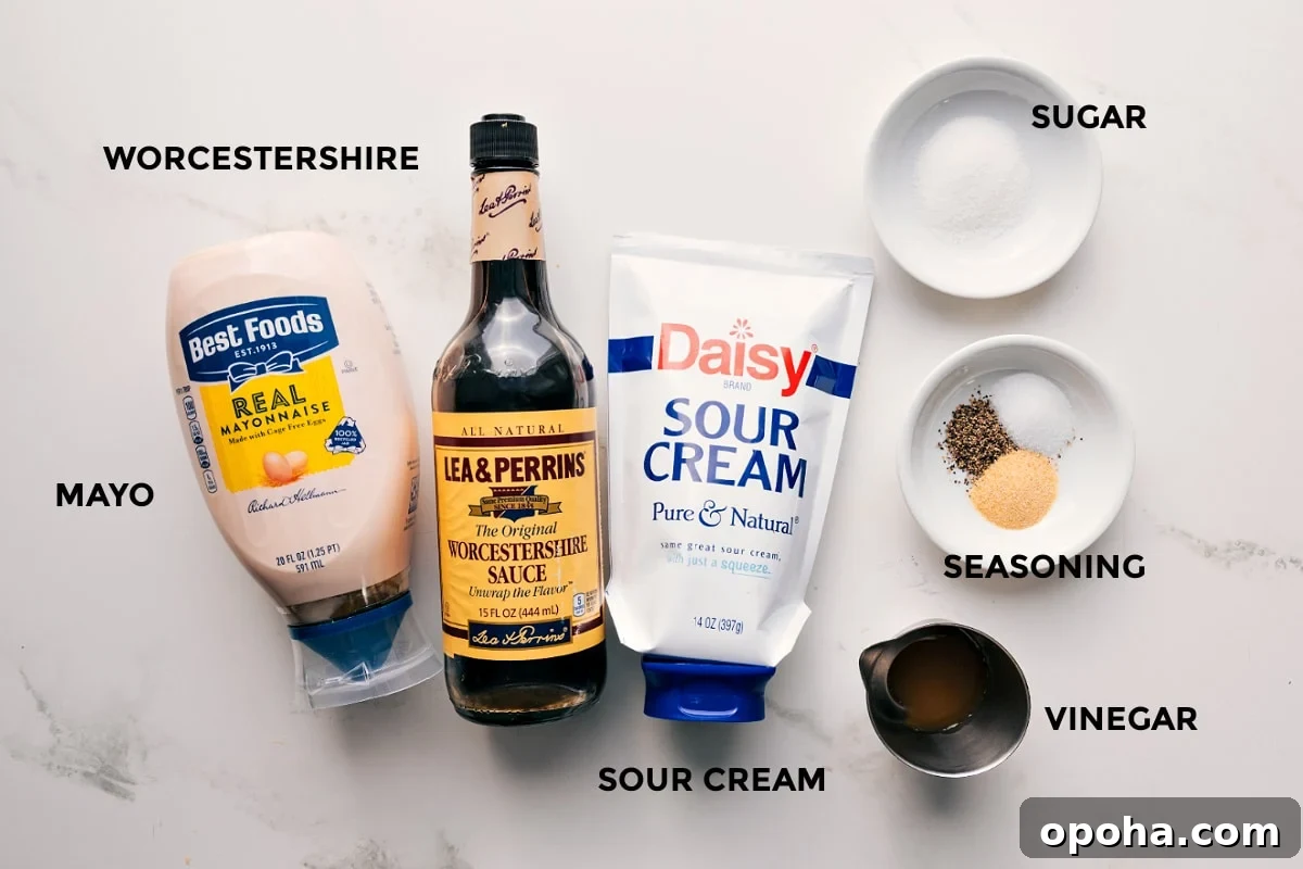 Dressing Ingredients For This 7 Layer Salad 7 layer salad dressing ingredients set out for easy assembly including mayo, Worcestershire sauce, sour cream, vinegar, seasoning, and sugar.
