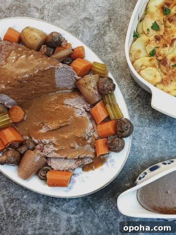 Slices of boeuf bourguignon on a serving dish.