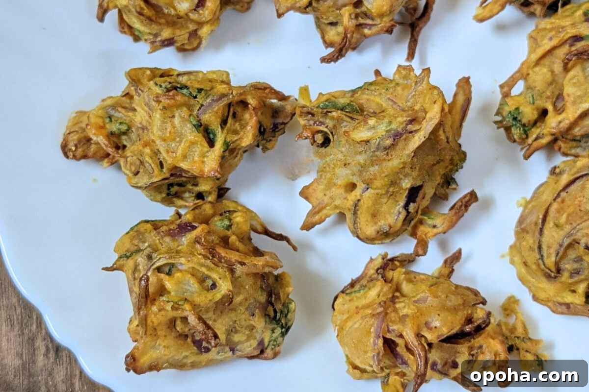 15 Classic Indian Vegetarian Recipes That Always Impress 8 Onion bhajis in a plate