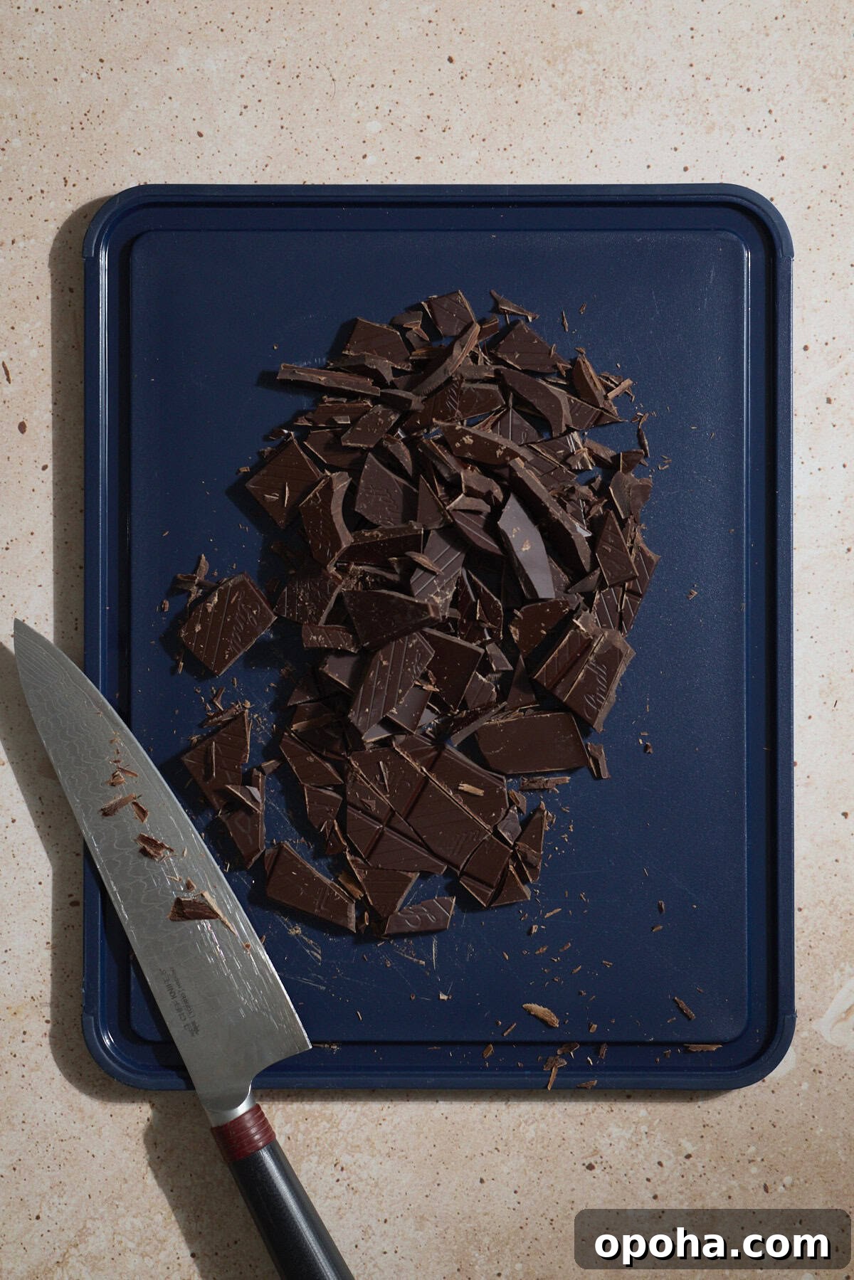 Decadent Dairy-Free Chocolate Mousse Recipe 4 Chopped chocolate on a cutting board.