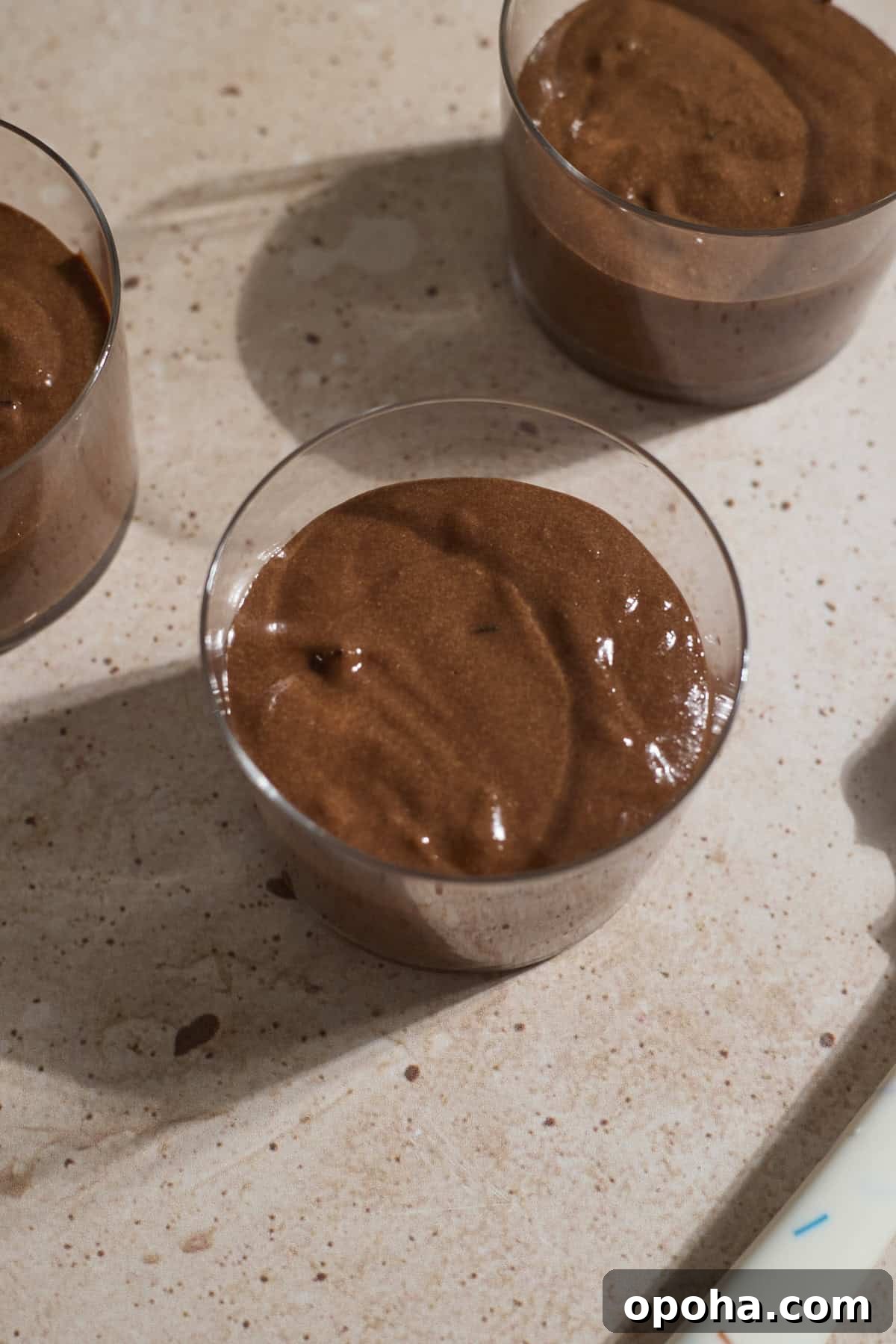 Decadent Dairy-Free Chocolate Mousse Recipe 9 Chocolate mousse spooned into serving glasses.