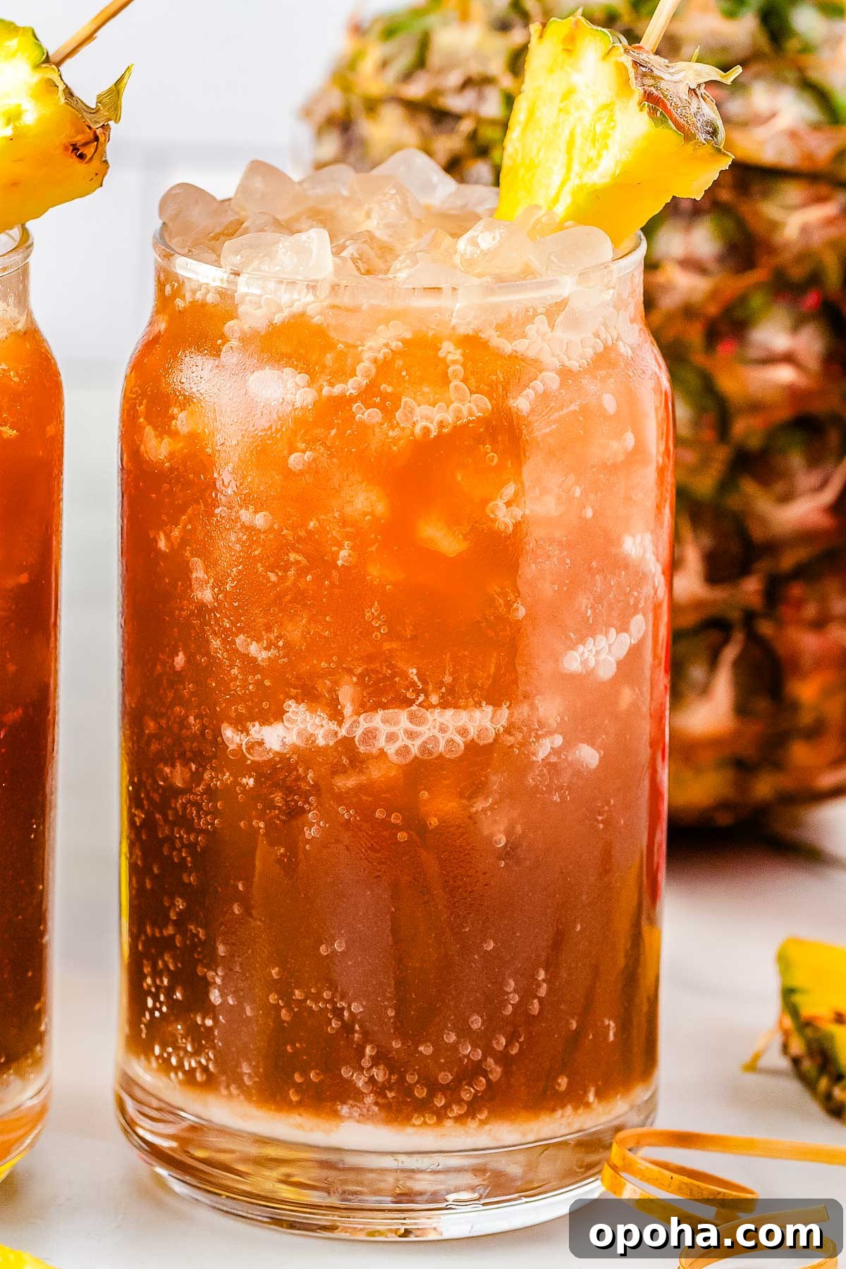 Swig Waikiki Drink Recipe — Copycat Sparkling Island Mocktail 7 A Swig Waikiki drink garnished with a pineapple slice.