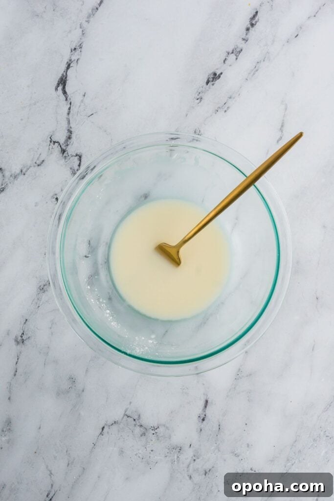 Cornstarch slurry for homemade gravy in a clear glass bowl.