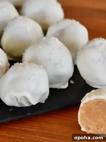 Cookie truffles on a wood cutting board.