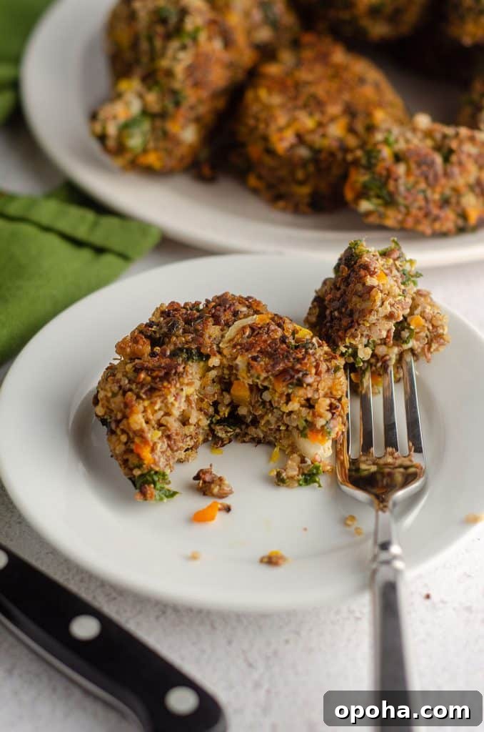Apple Quinoa Granola Recipe: Crunchy Baked Apple Quinoa Clusters 12 quinoa patty sitting on a plate with a bite taken out with a fork