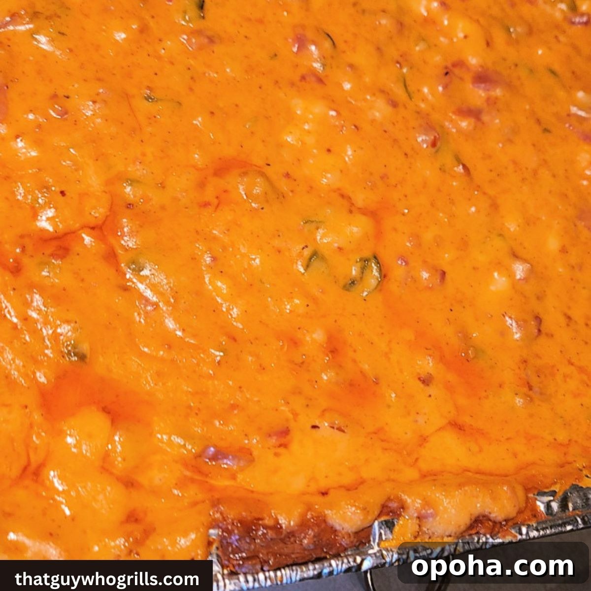 Pit Boss Smoked Queso Dip — Creamy BBQ Cheese Dip Recipe 2 Pitboss smoked queso in tin foil pan