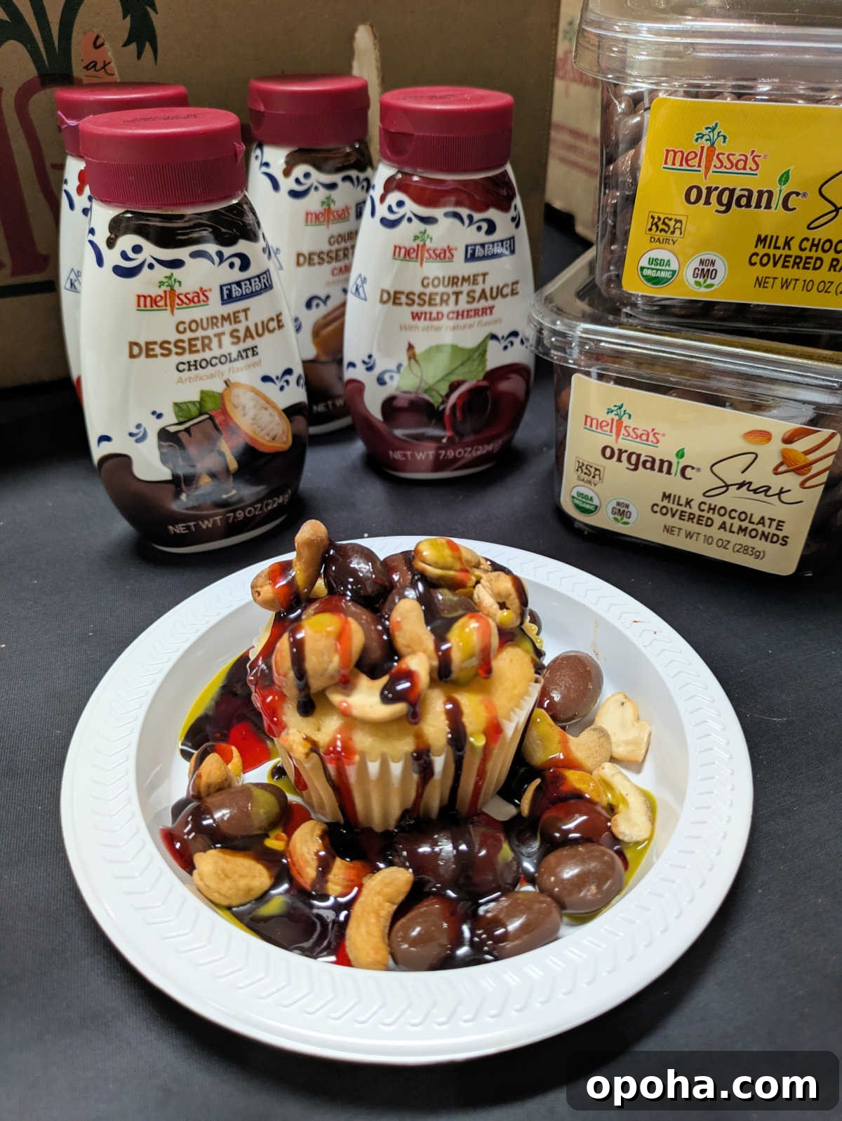 cupcake topped with melissas organic snax and fabbri dessert sauce