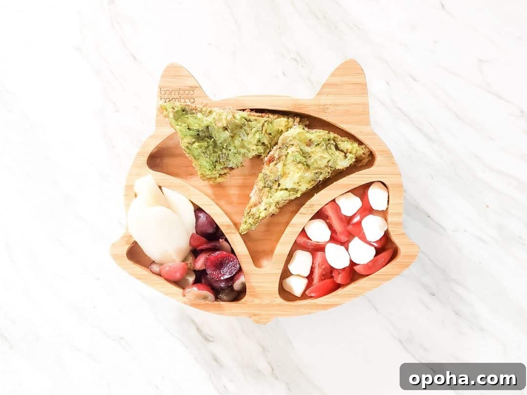 Baby-Led Weaning Meal Ideas: What Theo Loves to Eat 3 Avocado Toast BLW meal ideas. This photo is a fox plate on a marble table with my son's lunch in it. The lunch has cherries, grapes, pear, mozzarella cheese, tomatoes, and avocado on toast.
