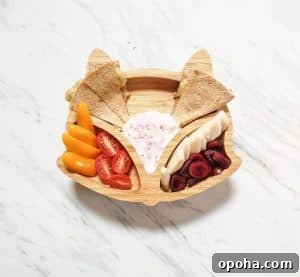 Baby-Led Weaning Meal Ideas: What Theo Loves to Eat 5 This is a photo of a fox kids plate. The plate contains cherries, yogurt, a quesadilla, pear and tomatoes.