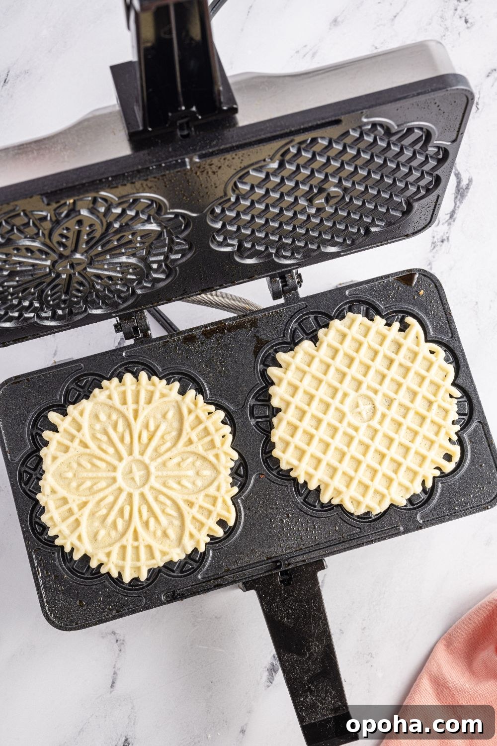 Traditional Italian Pizzelle Cookies: Crisp Anise Wafers Recipe 14 Pizzelles in iron on table