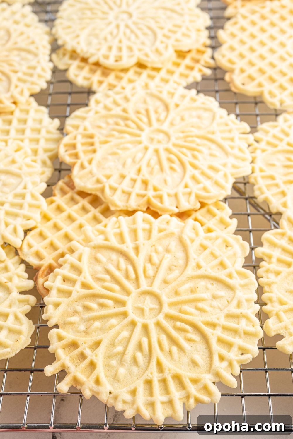 Traditional Italian Pizzelle Cookies: Crisp Anise Wafers Recipe 16 Pizzelles on cooling tray stacked on top of each other