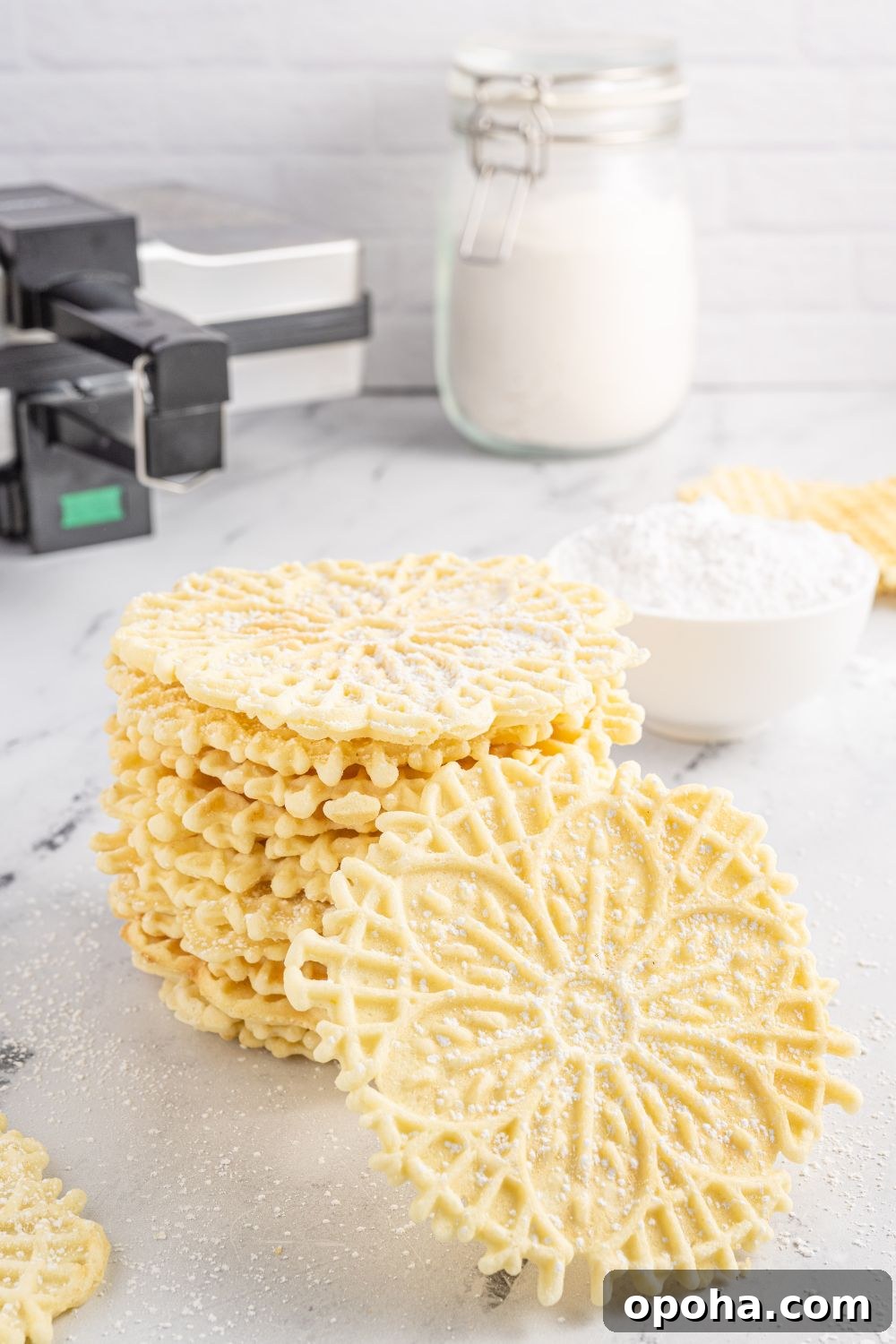 Traditional Italian Pizzelle Cookies: Crisp Anise Wafers Recipe 18 Pizzelles on tray with ingredients behind it