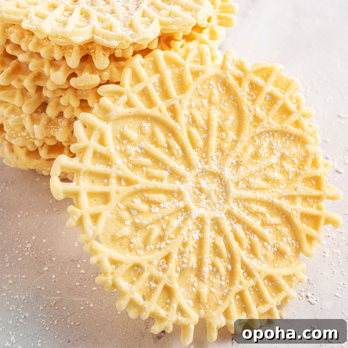 Traditional Italian Pizzelle Cookies: Crisp Anise Wafers Recipe 3 Pizzelles on marble table