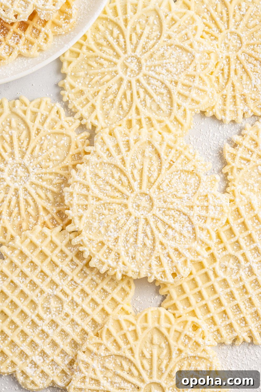 Traditional Italian Pizzelle Cookies: Crisp Anise Wafers Recipe 25 Pizzelles spread out on table
