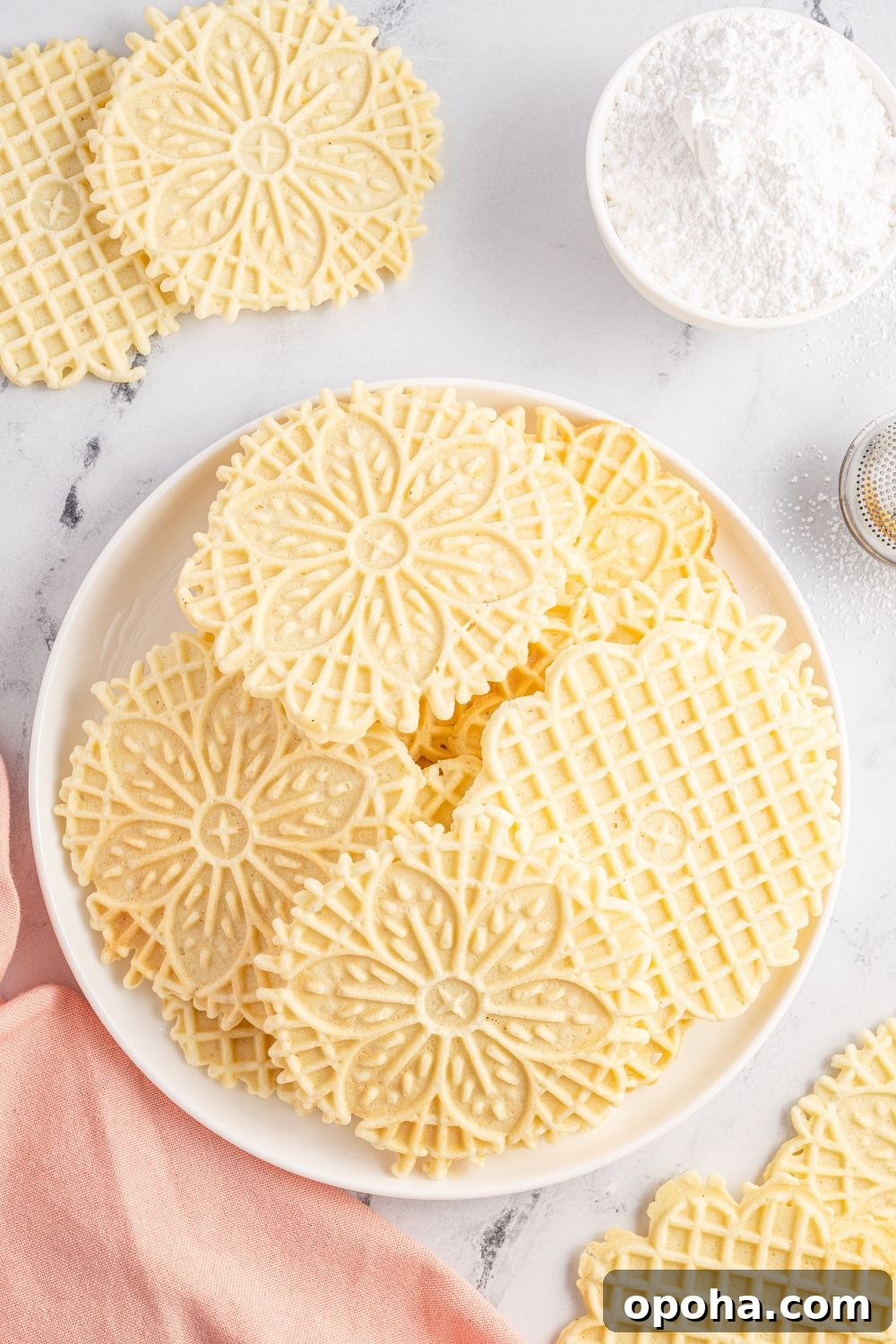 Traditional Italian Pizzelle Cookies: Crisp Anise Wafers Recipe 7 plate with pizzelle cookies on it