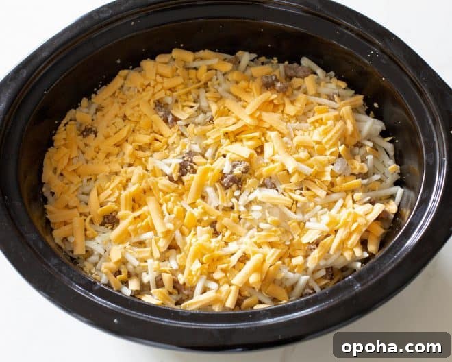 Overnight Crockpot Breakfast Casserole for Busy Mornings 6 cheese in a crockpot