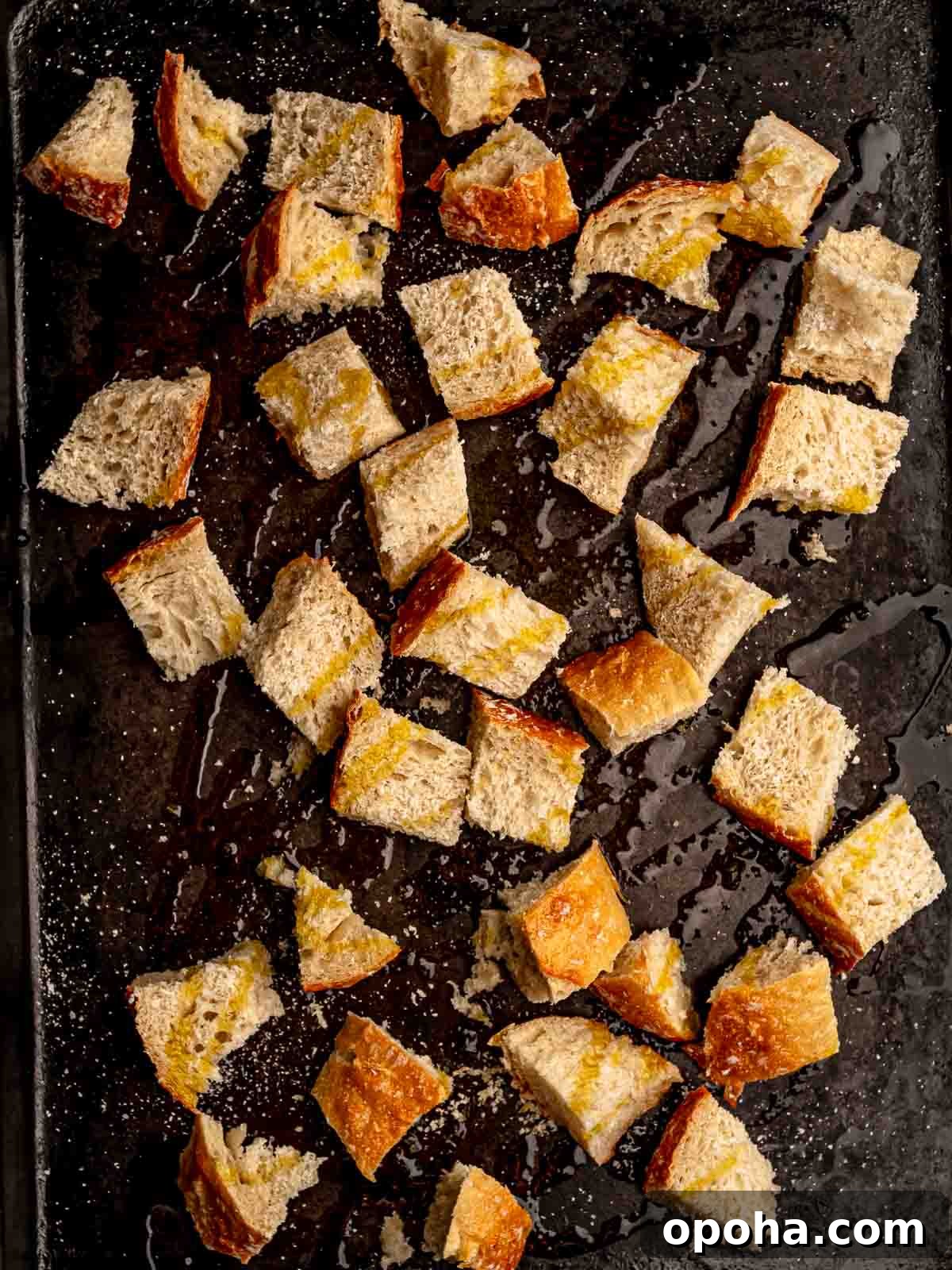 Tuscan Panzanella Salad: Classic Bread & Tomato Recipe 4 Diced bread on a sheet pan with olive oil.